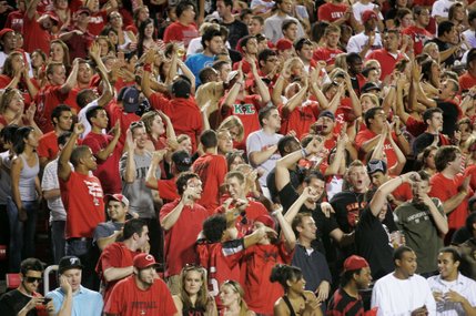 The UNLV student section erupts in cheers after the Rebels scored their first touchdown against Utah State at Sam Boyd Stadium.