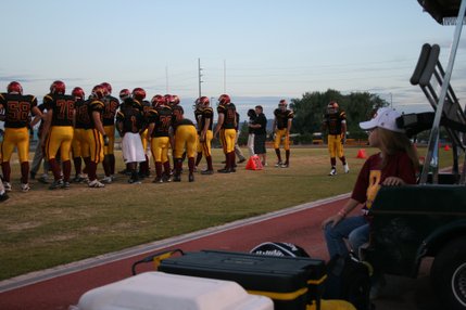 A young Del Sol fan watches from the sidelines Friday as her team faces off against Valley High School.