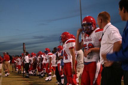 Members of the Valley High School football team catch their breath and regroup during Friday's game at Del Sol.