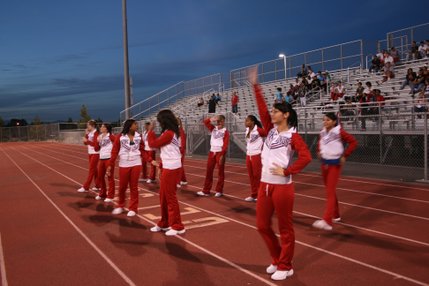 Valley High School cheerleaders show their team spirit as their school's football team visited Del Sol on Friday.