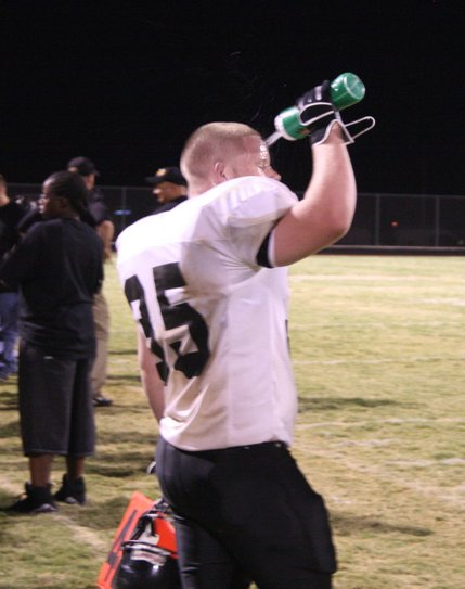 Clark High School football team member Michael Withers cools off Friday during the team's heated game against Coronado.