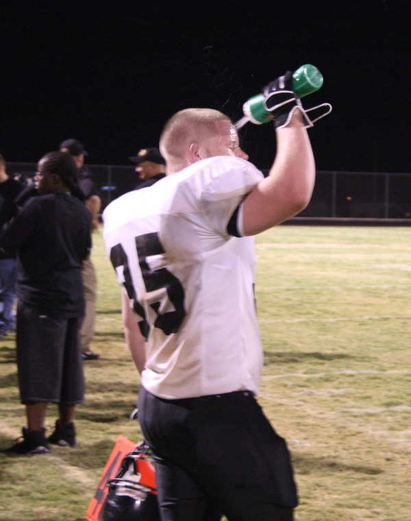 Clark High School football team member Michael Withers cools off ...