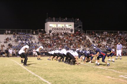 The Clark and Coronado football teams line up during Friday night's matchup at Coronado. 