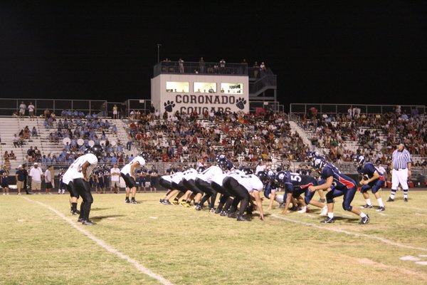 The Clark and Coronado football teams line up during Friday ...