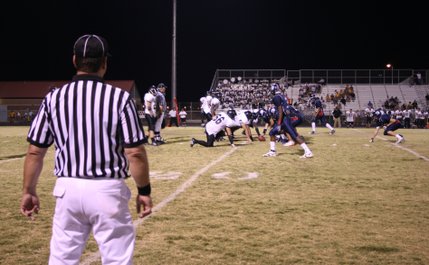 Players and officials get ready as the ball is about to be set into play late in the fourth quarter of Friday night's matchup between the Coronado and Clark football teams. 