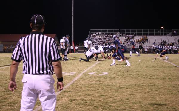 Players and officials get ready as the ball is about ...