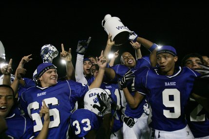 Members of the Basic High varsity football team celebrate after defeating Boulder City. 