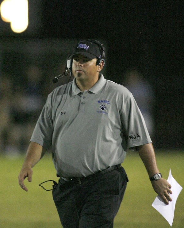 Basic High football coach Jeff Cahill walks on his home ...