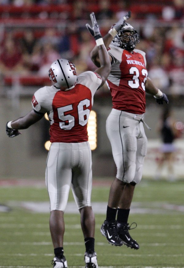 UNLV's Jason Beauchamp, right, celebrates with teammate Ronnie Paulo after ...