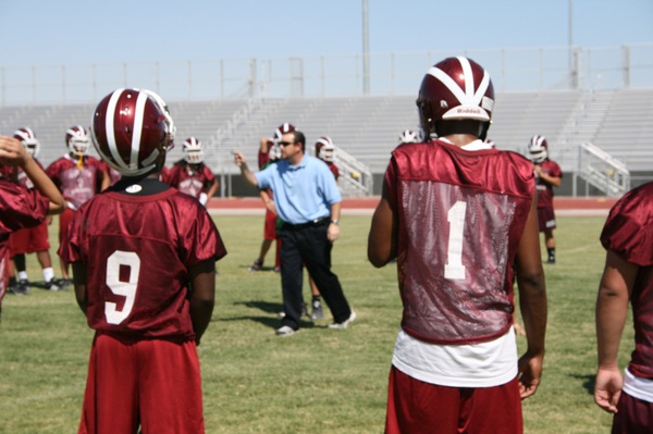 Coach Mike Jenkins talks to his team during Thursday's practice.