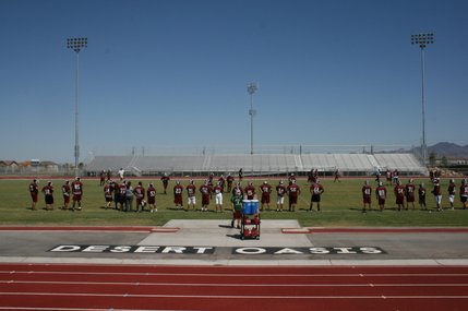 The Desert Oasis football team practices in an new, but empty, stadium on Thursday.