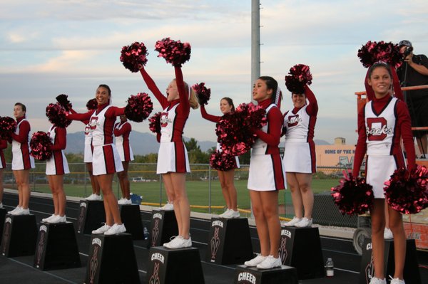 The Diamondback cheerleaders react to a play at the beginning ...
