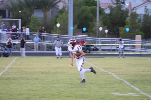 Junior free safety Codey Berndt runs with the ball during ...