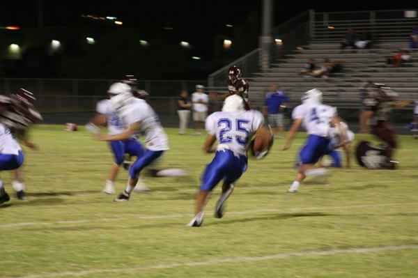 Junior running back Stephen Nixon carries the ball during Friday's ...