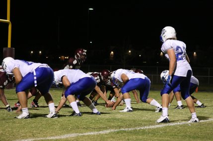 Lineman Bryan Sherman prepares to snap the ball during the third quarter of Friday's game against Dixie.