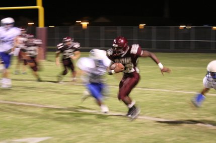 Running back James Poole breaks past Dixie defenders during Friday's game.