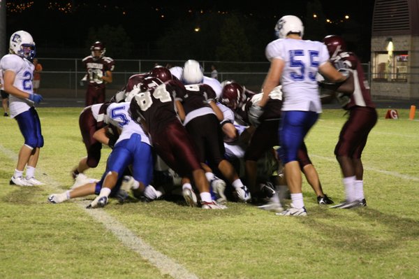 Flyers and Spartans fight for the ball during Friday's game ...