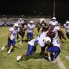 Dixie's Chance Harmon and Bill Katoa take down Cimarron-Memorial's James Poole.