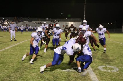 Dixie's Chance Harmon and Bill Katoa take down Cimarron-Memorial's James Poole.