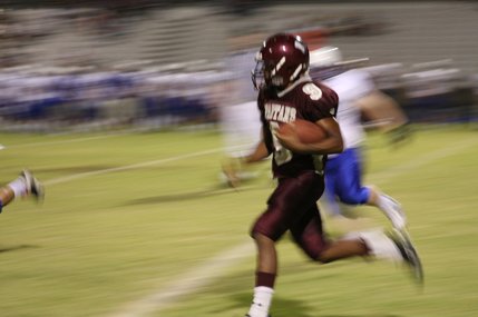 Quarterback Kenneth Banks runs with the ball during Friday's game. 