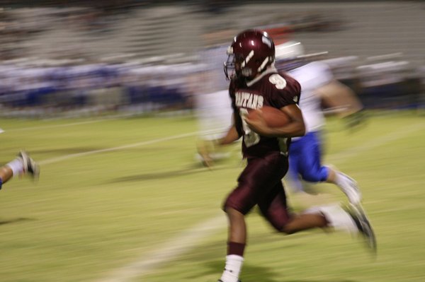 Quarterback Kenneth Banks runs with the ball during Friday's game.