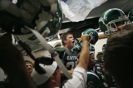 Green Valley wide receiver Kyle Larimer, center, hypes up his team in the locker room before a home game against Bonanza last Friday.