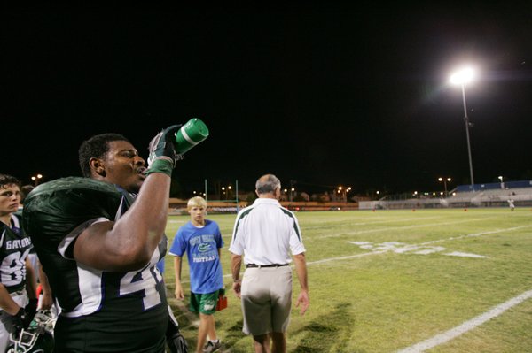 Green Valley's Derrick Garrett cools off during the season opener ...