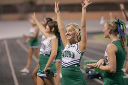 Green Valley cheerleaders work the crowd during a home game against Bonanza High Friday night. 