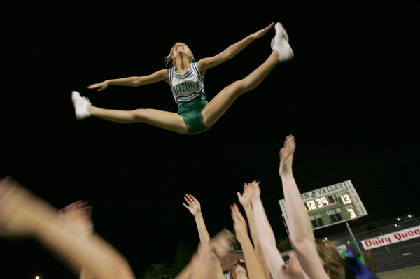 Green Valley varsity cheerleader Lexi George is catapulted in the ...