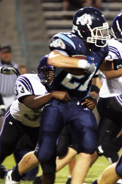 Durango linebacker Brain Harrison attempts to bring down Centennial wide receiver Matt Holley during the football season opener at Centennial High School.