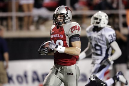 UNLV's Ryan Wolfe runs in for UNLV's third touchdown against Utah State after a pass reception at Sam Boyd Stadium.
