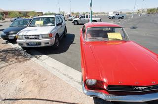 Used vehicles for sale are seen on display during a community auto display in the parking lot of Silverado High Saturday, August 23, 2008.