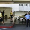 A Bally's security officer, right, stands by as Las Vegas Metro Police officers investigate a fatal 