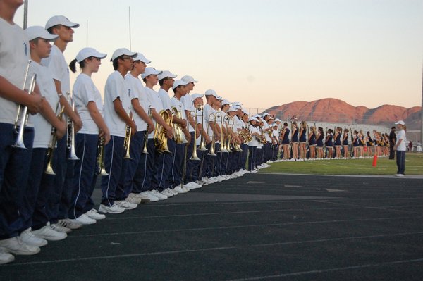 The Foothill High School marching band and cheerleaders stand waiting ...