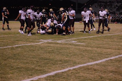 Cimmaron-Memorial's defense takes down running back Algernon Sewell in the second quarter. Sewell rushed for a total of 147 yards and two touchdowns on Friday night. 