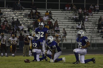 Members of the Basic High School football team wait Friday as Eldorado plots its next play. Despite the Sundevils' efforts, Basic's defense proved to be too much and the home team came out ahead, 28-13. 