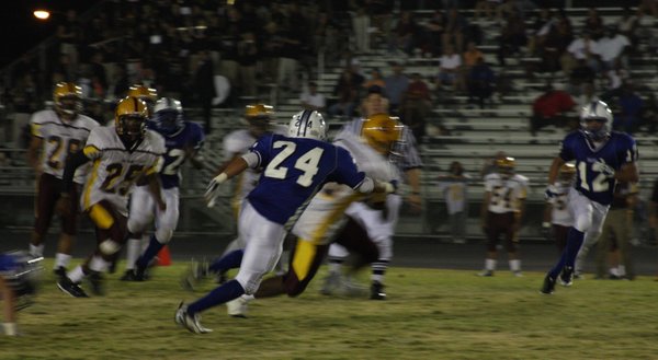 Basic cornerback Omar Valenzuela attempts to catch up with an ...