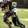 Andre Clay, left, of Clark High School is tackled by Cedric Williams of Rancho High School during their game at Clark High School in Las Vegas  Friday, September 5, 2008. 