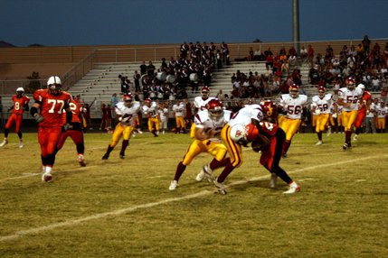Del Sol's Tayiib Dauda takes down Chaparral's Pierre Jones during the first quarter of Friday's game.