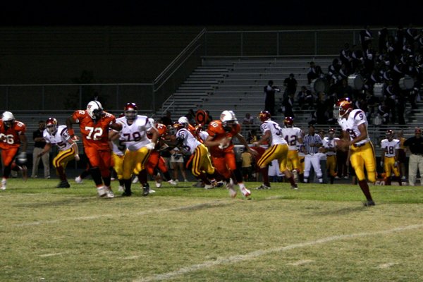 Del Sol quarterback Saei Huihui looks for an open receiver ...