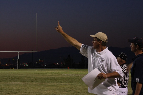 A member of the Coronado coaching staff calls a play ...