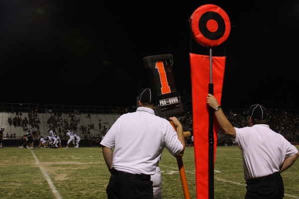 Linemen wait for the next play to begin Friday during ...