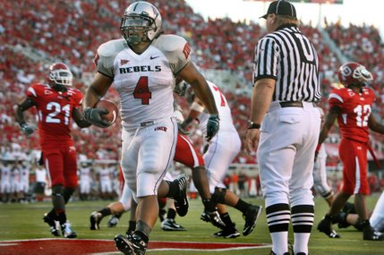 UNLV running back Frank Summers walks into the end zone with UNLV's second touchdown to take a 14-7 lead in the first half. 