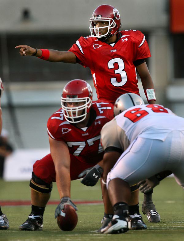 Quarterback Brian Johnson directs the blocking during a first-half play ...