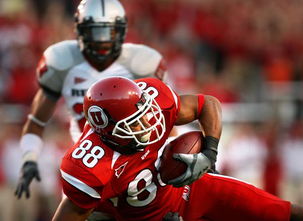 Utah wide receiver Freddie Brown takes this pass 28 yards ...