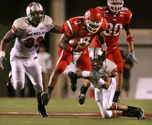 Utah quarterback Brian Johnson runs 19 yards to the UNLV ...