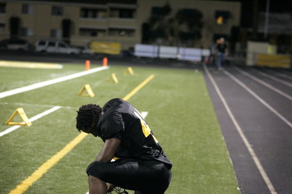 Phillip Murray of Clark High School bows his head after ...