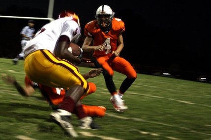 Two Chaparral defenders take down Del Sol running back Earnest Hall during Friday night's game.