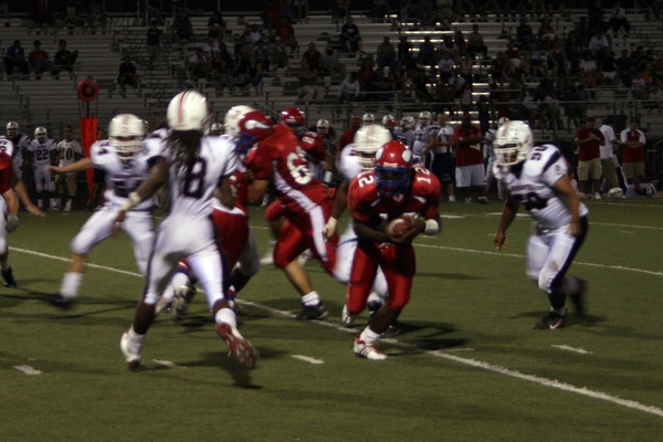 Valley quarterback Kerwyn Williams clings to the ball during the ...