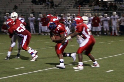 Valley quarterback Kerwyn Williams passes the ball to Malcolm Wilks during Friday's game against Liberty.